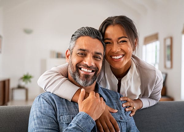 happy hopeful adoptive couple